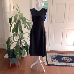 White House Black Market black sleeveless midi dress with pockets. Size 6.